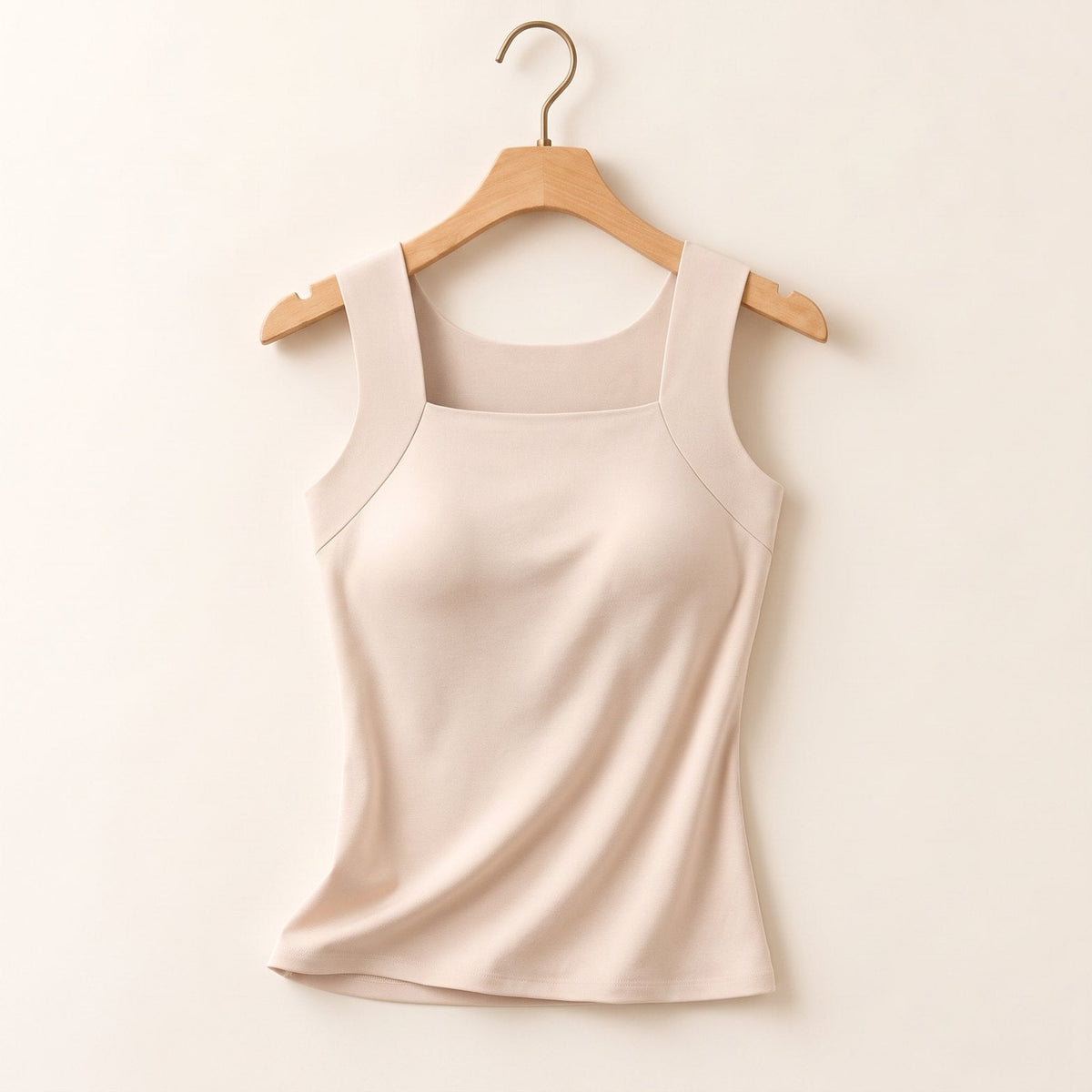 Beige built-in bra tank on a hanger